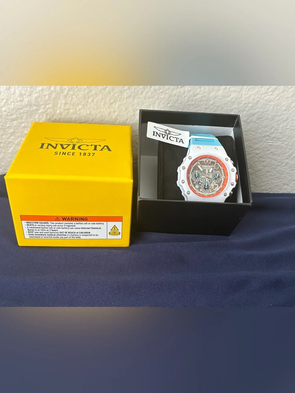 Invicta White Watch with Coral Orange Bezel and Aqua Strap
